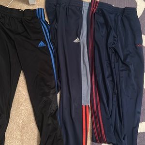 Three (3) Adidas sweatpants, M black/blue, black /crimson , black/grey & orange